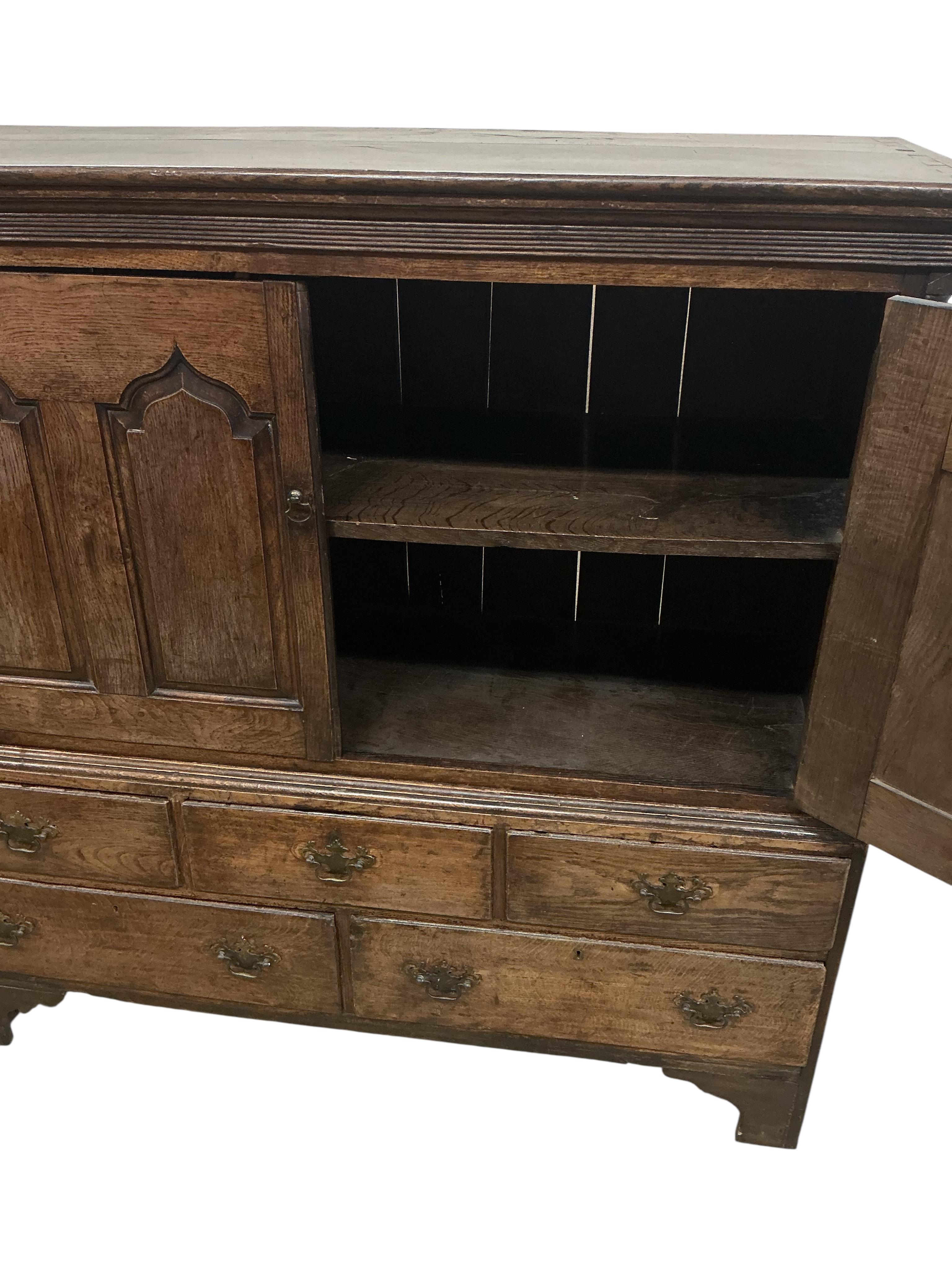 A late 18th century North Wales oak press cupboard, width 136cm, depth 51cm, height 136cm